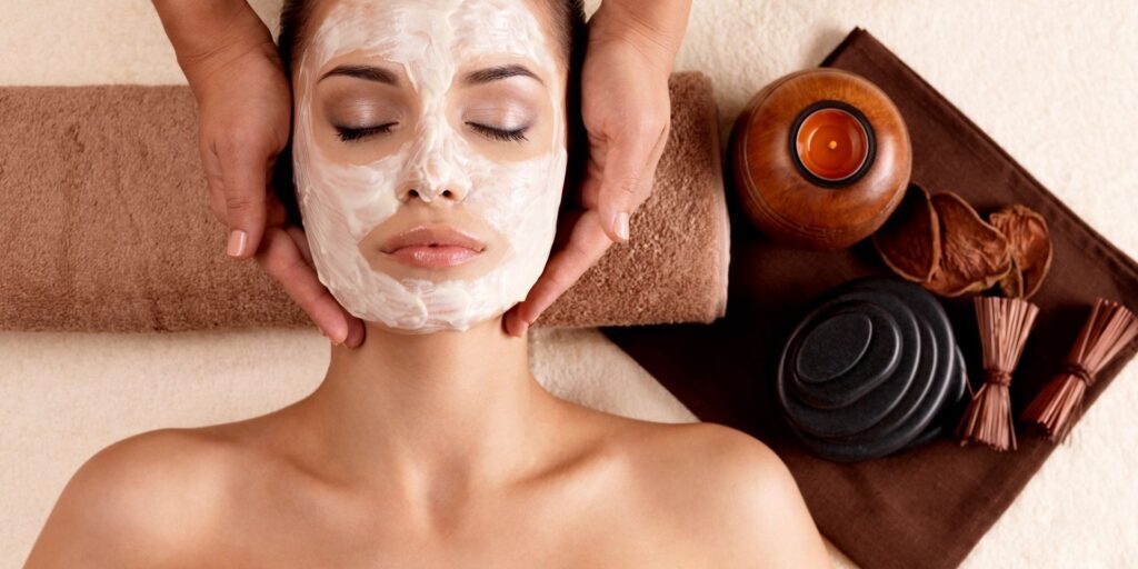 woman having facial skin care treatment